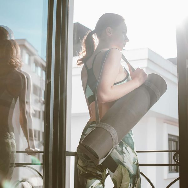 Woman feeling energetic and balanced in a bright space.